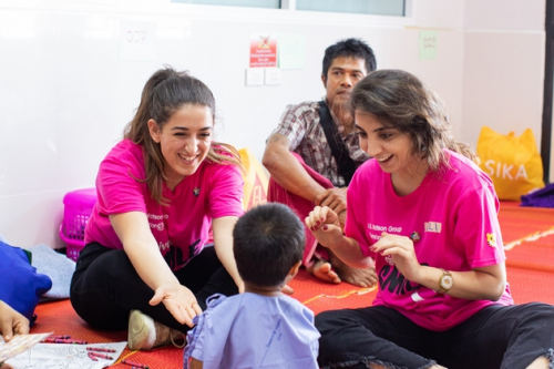 Berna Yilmaz (left) plays with the cleft patients in the hospital ward, creating a warm and relaxing environment before surgeries