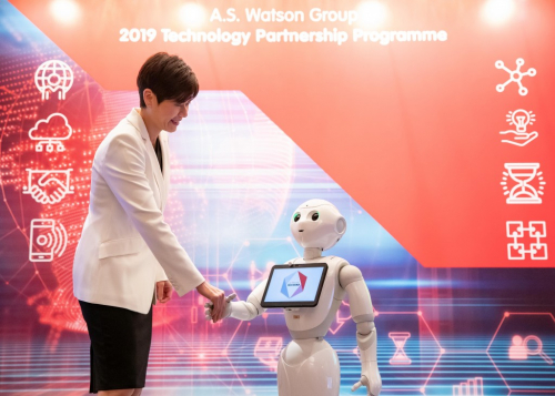 Malina Ngai, Group Chief Operating Officer of AS Watson Group, visits a Tech Partner exhibition booth at the Technology Partner Day which demonstrates the use of robotics in retail