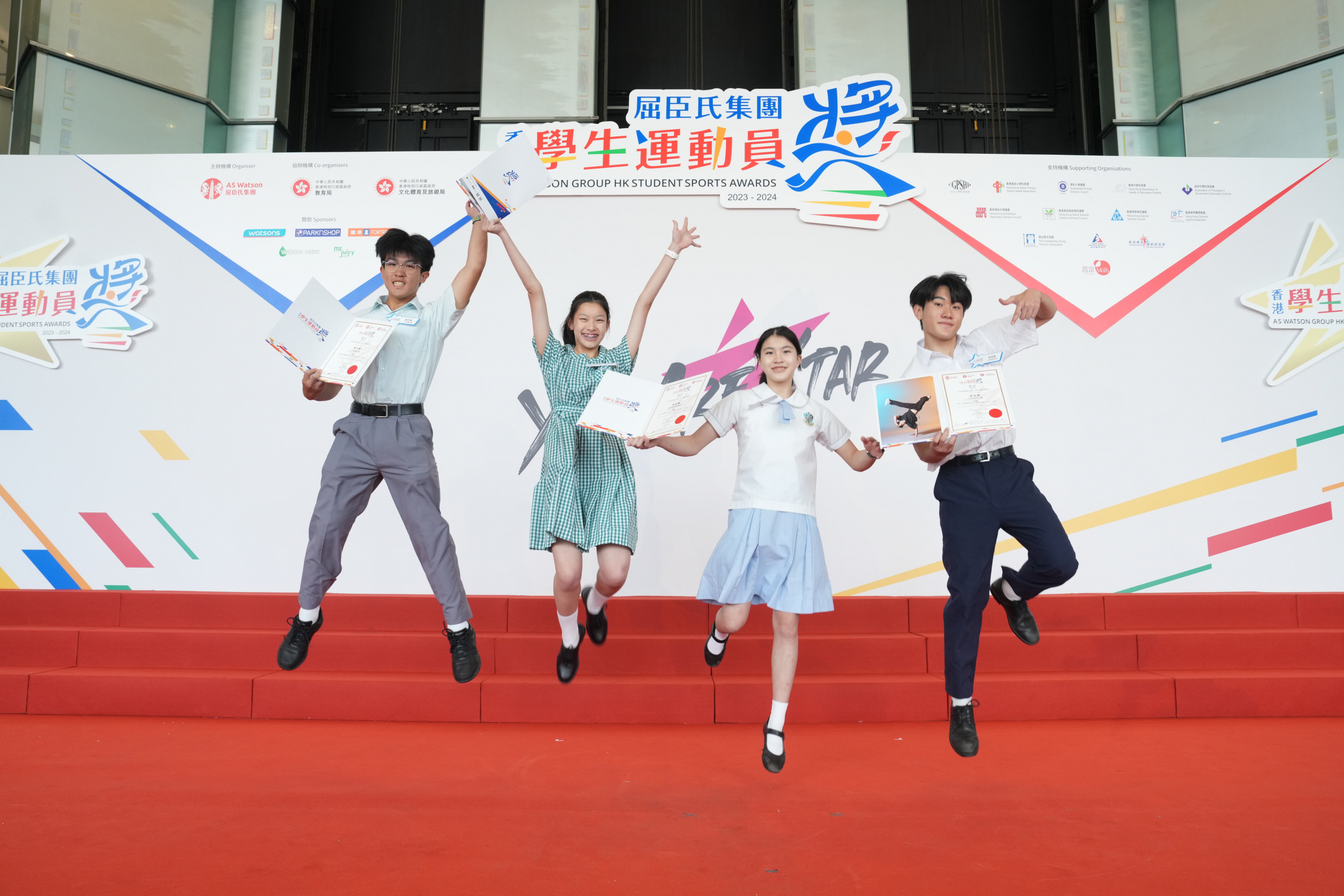 Being recognised for their achievements, student awardees smile with a glow